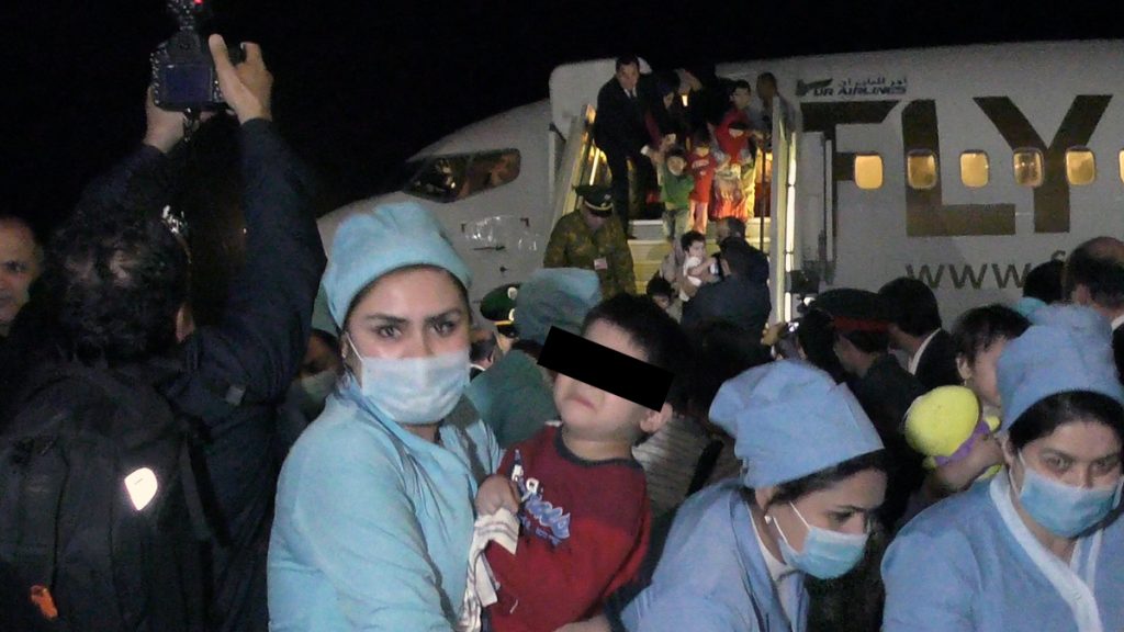 Meeting of children arriving from Iraq at the Dushanbe airport. Photo: CABAR.asia